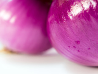 Red onion isolated on a gray background