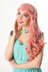 Beautiful girl smiling on a white background.