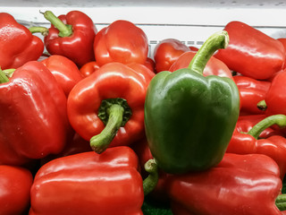 Only one green sweet pepper and Red Sweet peppers on the shelves in supermarkets