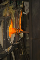 Glass furnace. Glass Blower at Work