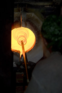 Glass furnace. Glass Blower at Work