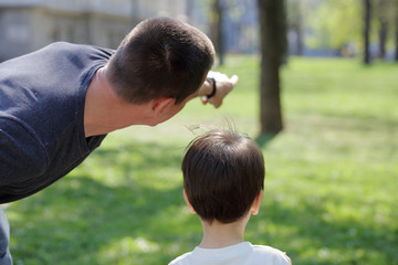 Father and his son in park enjoying time together