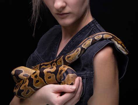 Woman holding royal python