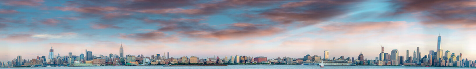 Panoramic sunset view of New York City skyline from Jersey City - obrazy, fototapety, plakaty