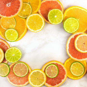Vibrant frame made up of juicy citrus fruits