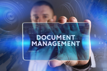 Fototapeta premium Business, Technology, Internet and network concept. Young businessman working on a virtual screen of the future and sees the inscription: Document management