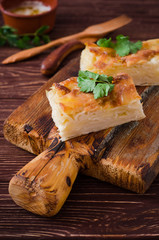 Traditional Georgian cheese layer pie Achma on wooden background. Selective focus