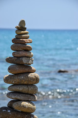 Pile of rocks in front of the Sardinia sea