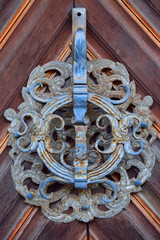 Knocker on the door. Beautiful old ornate knocker.