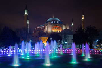 Fototapeta na wymiar Hagia Sophia (Ayasofya) and fountain view from the Sultan Ahmet Park in night, Istanbul, Turkey; 