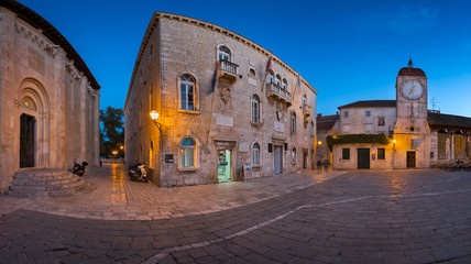 Fototapeta premium Panorama of Saint Sebastian Church and Trg Ivana Pavla II in the Evening, Trogir, Dalmatia, Croatia