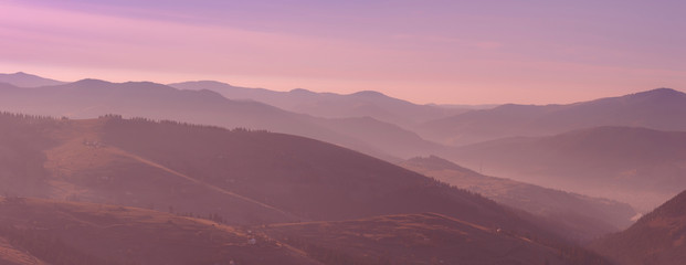 Beautiful pink morning sunrise in the mountain landscape