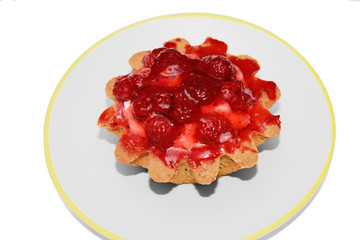 Berry cake on a plate on a white background