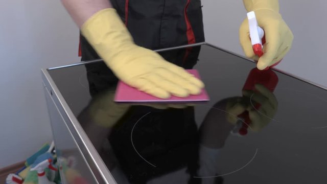 Worker cleaning surface of electric cooker