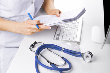 Medicine doctor's working table with medical document and stethoscope. Healthcare concept 