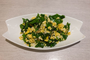 Southern Thai Vegetable Stir Fried with Eggs on the white plate