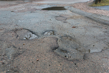 Pot holes with water in road