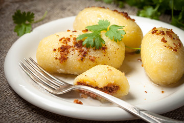 Potato dumplings stuffed with minced meat.