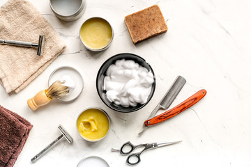Tools for cutting beard in barbershop on workplace background top view