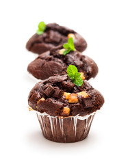 Triple  chocolate muffins isolated on white