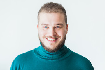 Portrait of a young bearded man smiling