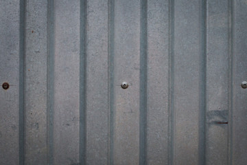 Background of an iron fence with screws