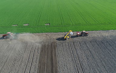 Agricultural work on field in spring