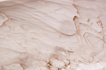 Background: dunes, sand waves inflated by the wind