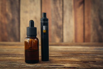 electronic cigarette on brown wooden background