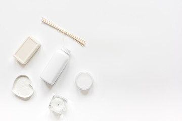 white cosmetic set on desk background top view mock up