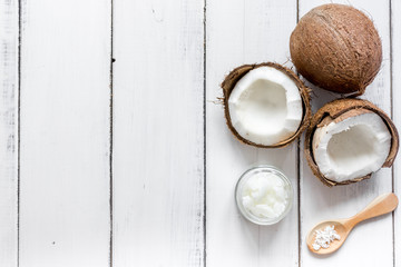 Fototapeta na wymiar organic cosmetics with coconut on white background top view