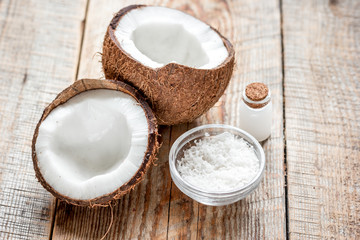 organic cosmetics with coconut on wooden background