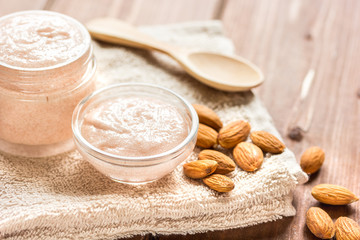 natural scrub with almond on wooden table background