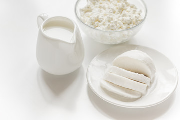 Fresh dairy products on white desk background