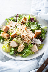 Caesar salad in white plate