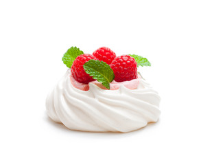 Mini  Pavlova meringue nest with berries and mint on isolated on white