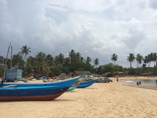 Fototapeta na wymiar Boats at Sri Lankan Beach