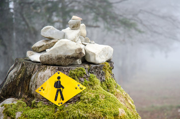 trekking under foggy stones