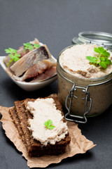 Forshmak  paste from herring on black stone background