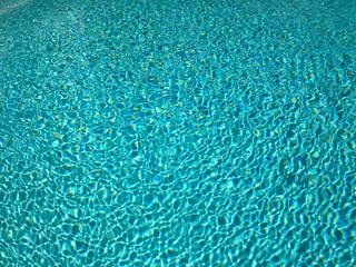 Blue swimming pool rippled water detail