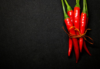 Red chili peppers on black background, Fresh hot chili peppers.
