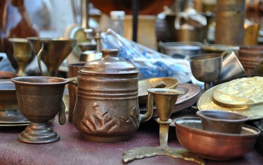 Antique objects displayed on flea market.