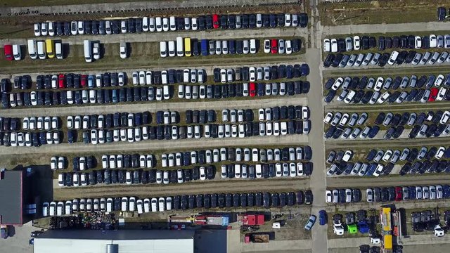 Aerial shot of new cars and trucks parking, top view. 4K video