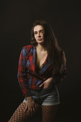 Awesome young model posing for model tests  in checkered jacket