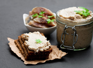 Forshmak  paste from herring on black stone background