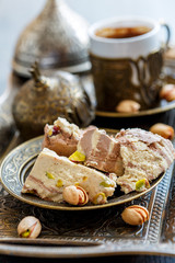 Turkish coffee and tahini halva with cocoa and pistachios.