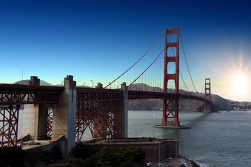 Golden Gate Bridge with sun in the sky, San Francisco, California