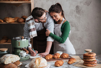 Man looking at is woman while cooking