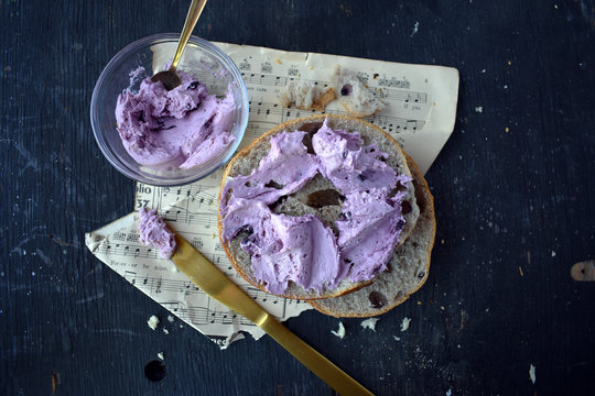 Blueberry Bagel With Blueberry Cream Cheese On Music Sheet