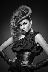 Fashion photo of young lady in elegant clothes with hairstyle